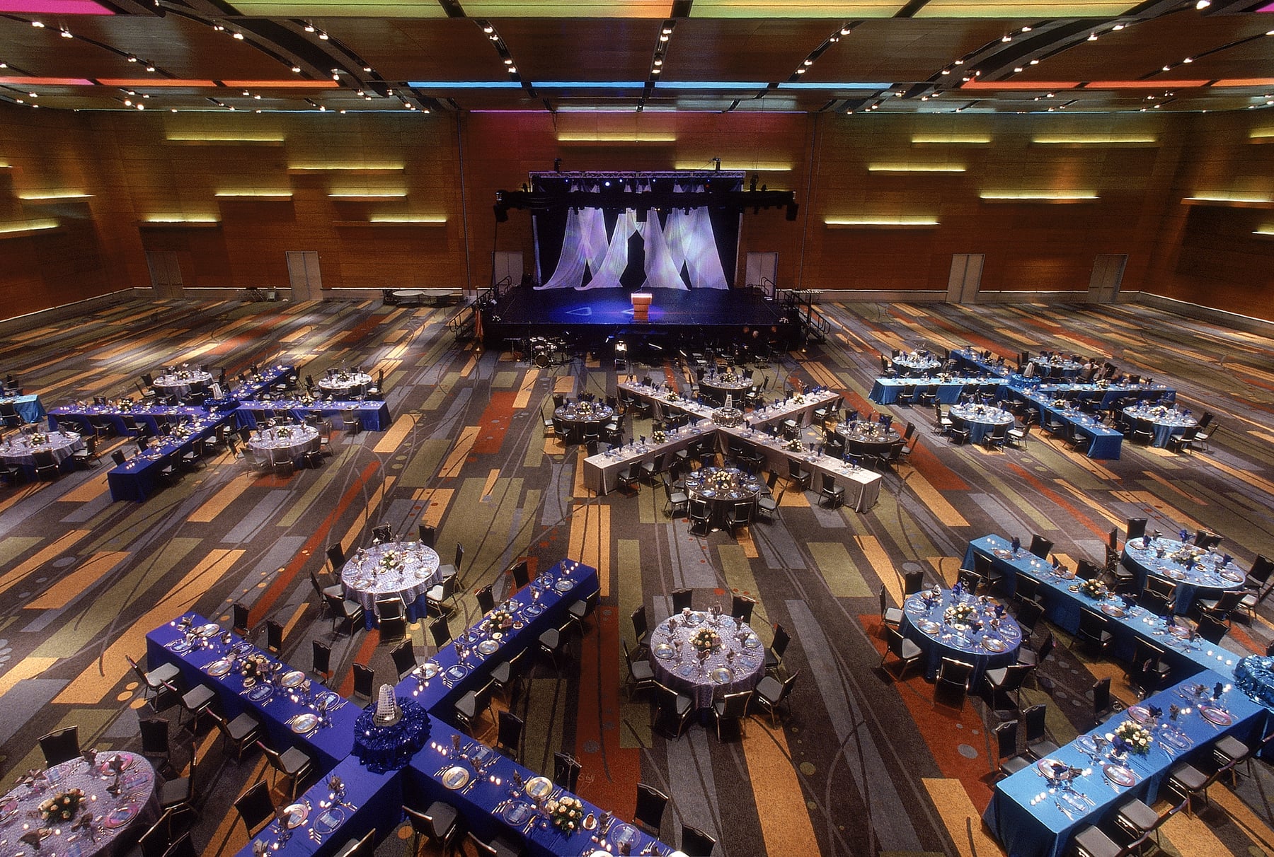 The ballroom at the Virginia Beach Convention Center, set for a banquet with a stage at the far end